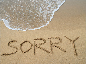 sorry in het zand geschreven